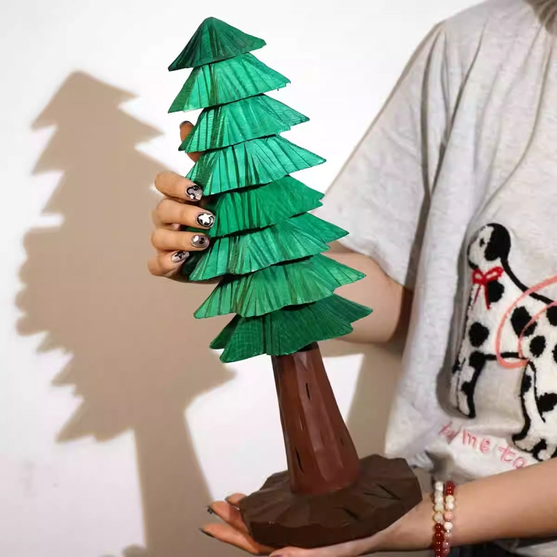 Hand-carved Large wooden Christmas tree with stacked green tiers and a brown trunk