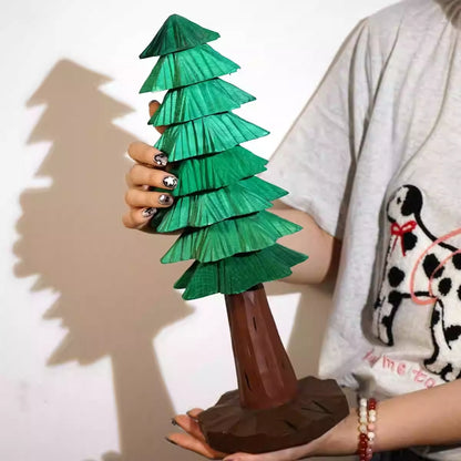 Hand-carved Large wooden Christmas tree with stacked green tiers and a brown trunk