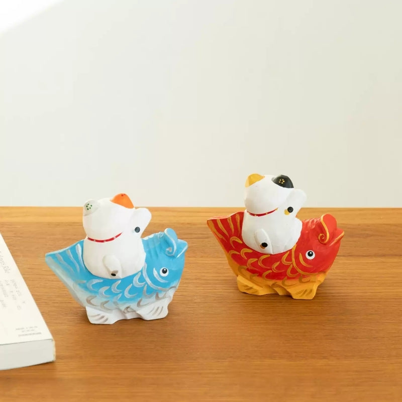 Hand carved lucky cat on koi figurine back view