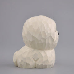 hand carved maltese dog figurine side view