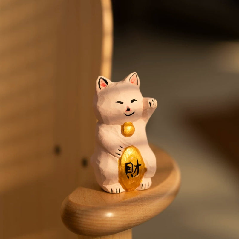 Hand carved maneki neko figurine holding fortune ingot