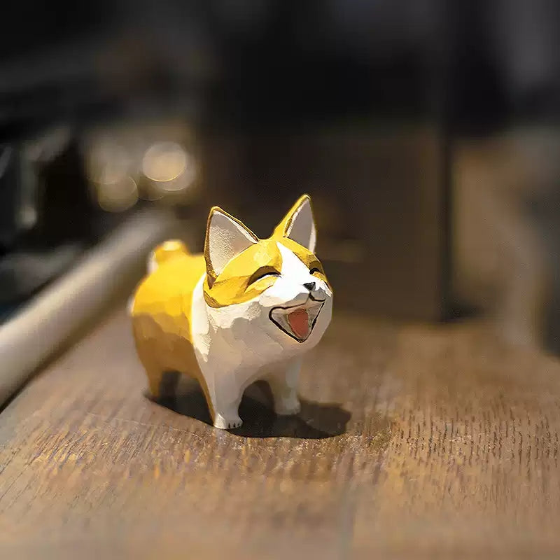 Hand-carved wooden corgi figurine with a laughing face and yellow-and-white coat