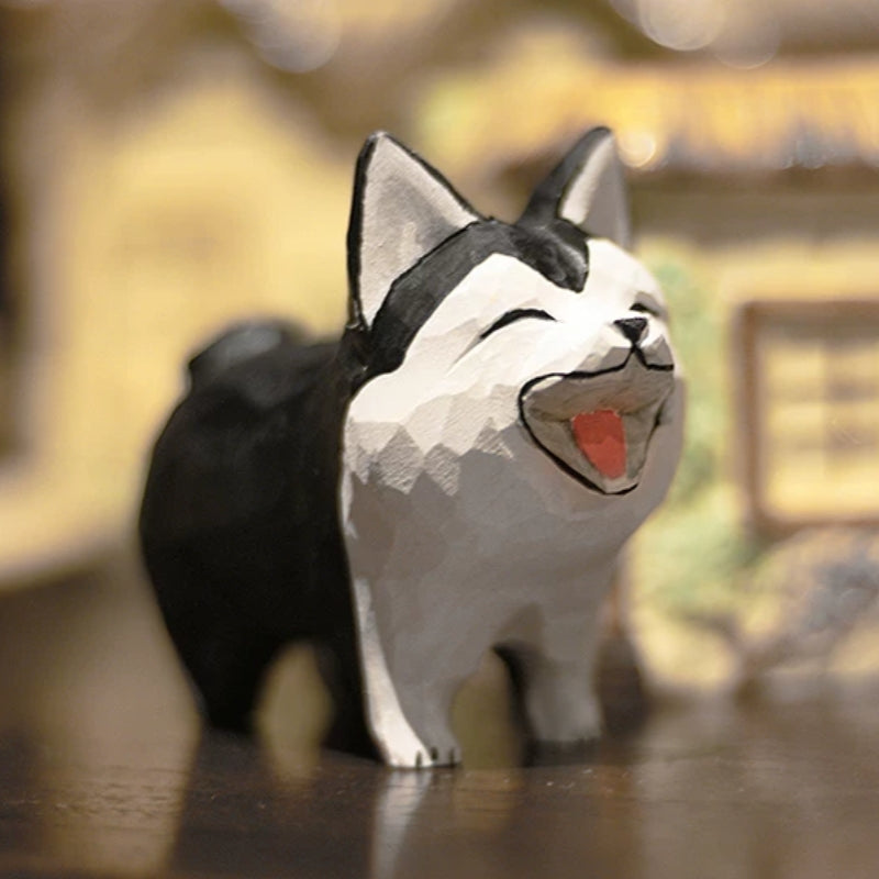 Hand-carved wooden husky figurine with an oversized head and laughing face
