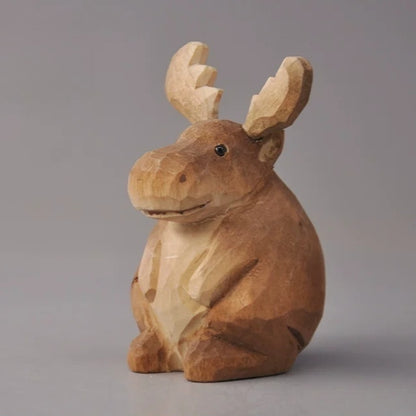 Hand-carved wooden moose figurine with broad palmate antlers and a round seated body