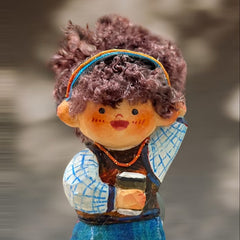 Front view of handcrafted wooden doll keychain featuring a girl with a coffee cup and curly yarn hair