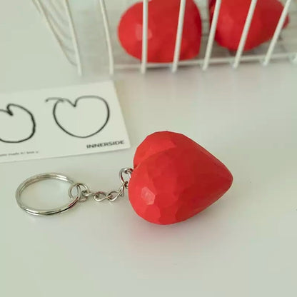 Angled view of red heart keychain