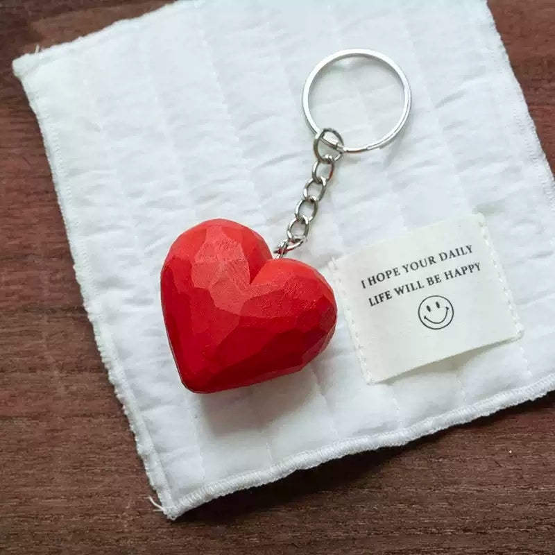 Red heart keychain with happy note