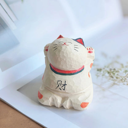 Japanese lucky cat figurine both paws raised