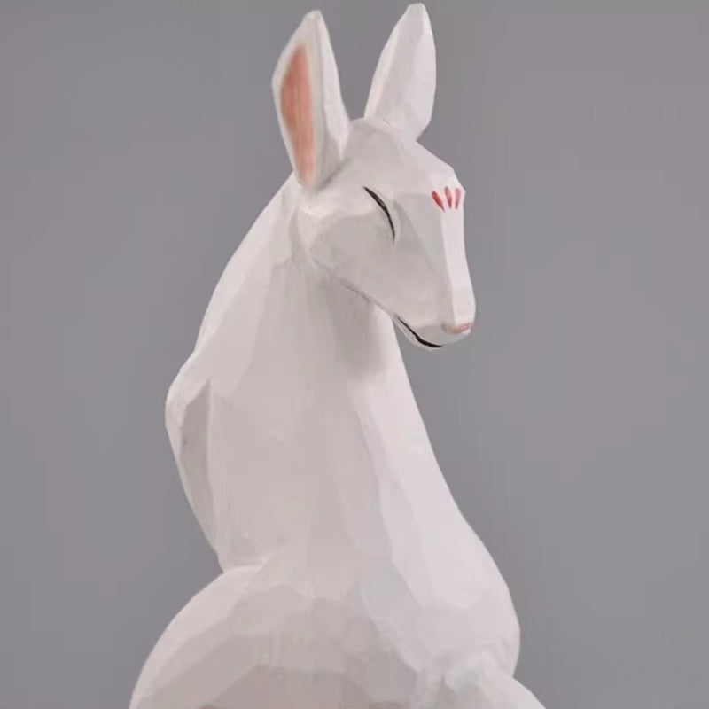 Wooden kitsune figurine without base shown from side
