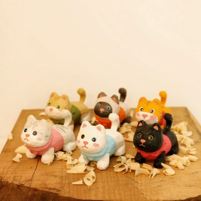 Six kitten figurines in colored outfits