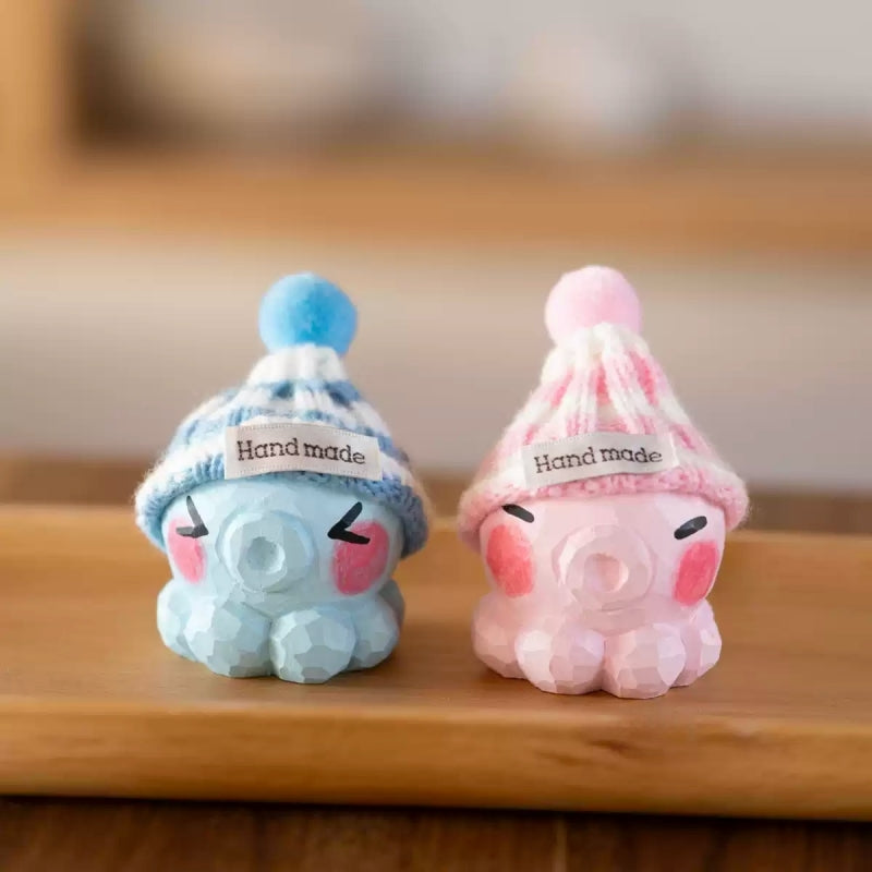 Blue and pink knit hat octopus figurines