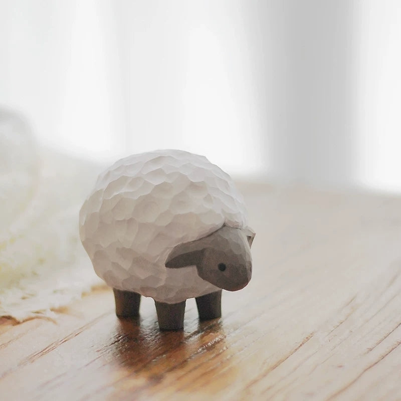 Lamb figurine on windowsill in soft natural light