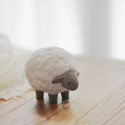Lamb figurine on windowsill in soft natural light