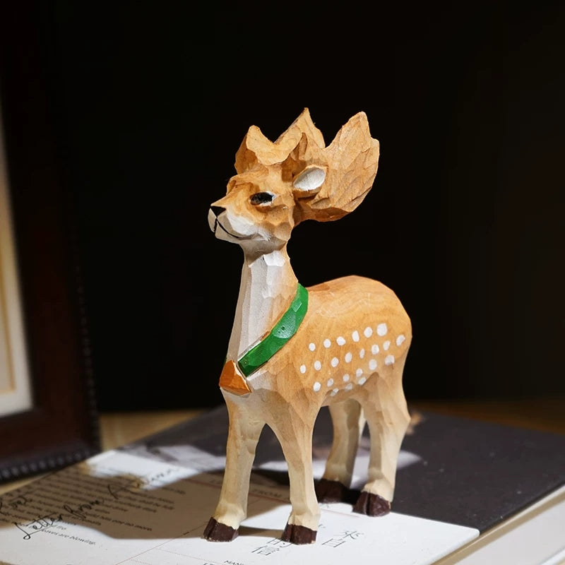 Large Sika deer figurine with hand-painted white spots and a green scarf
