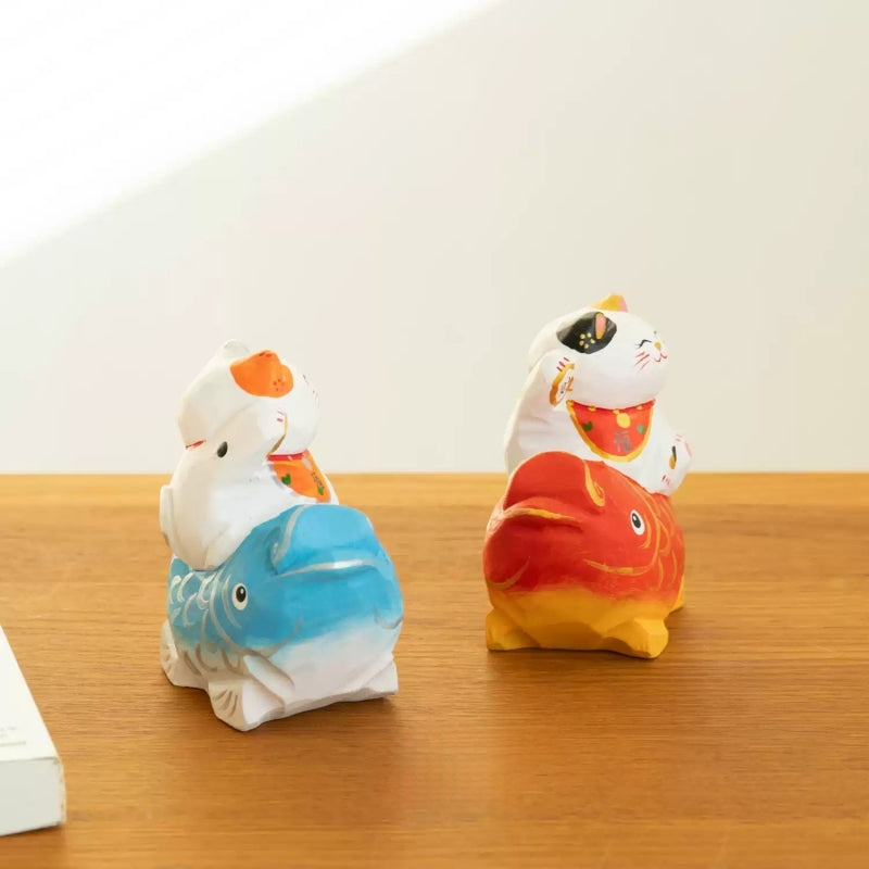 Lucky cat on koi wooden figurine side view