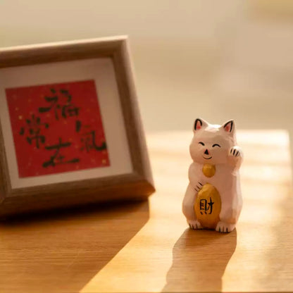 Maneki neko figurine with red calligraphy frame