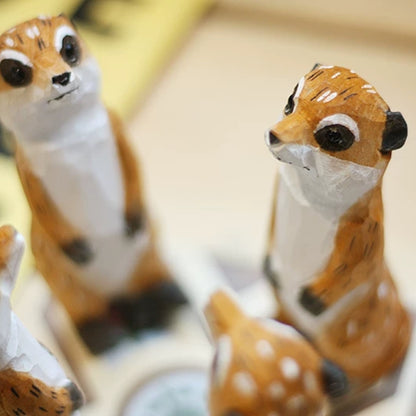 Group of meerkat figurines together close-up