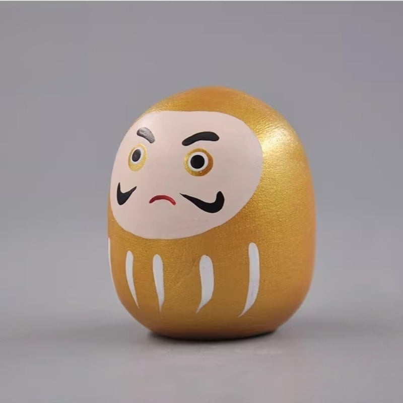 metallic-gold-daruma-doll-side-view