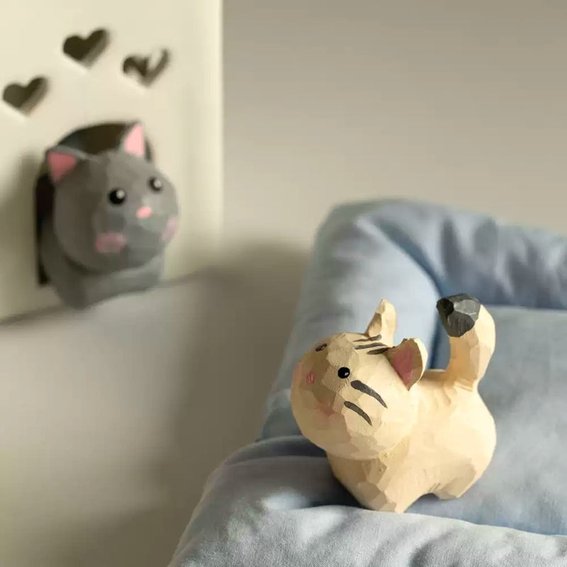Gray and cream tabby mini cat figurines in bedroom