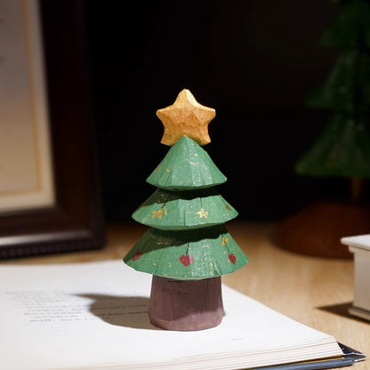 Mini wooden Christmas tree with painted details, thick trunk, and a large gold star
