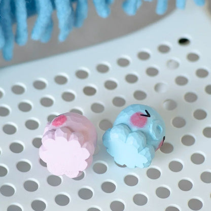 Top view of pink and blue octopus figurines