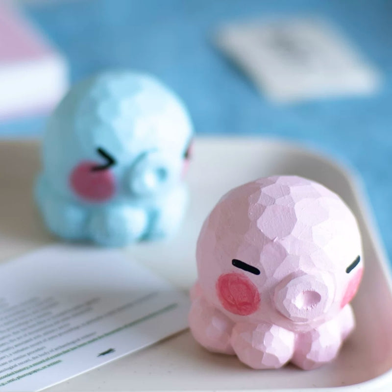 Pink and blue octopus figurines without hats