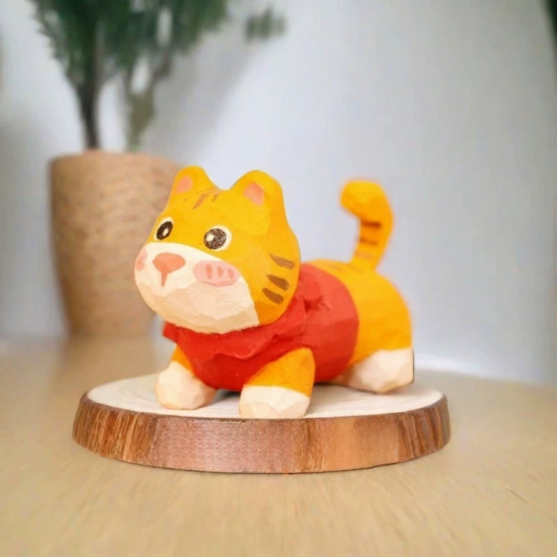 Orange tabby kitten figurine in red sweater