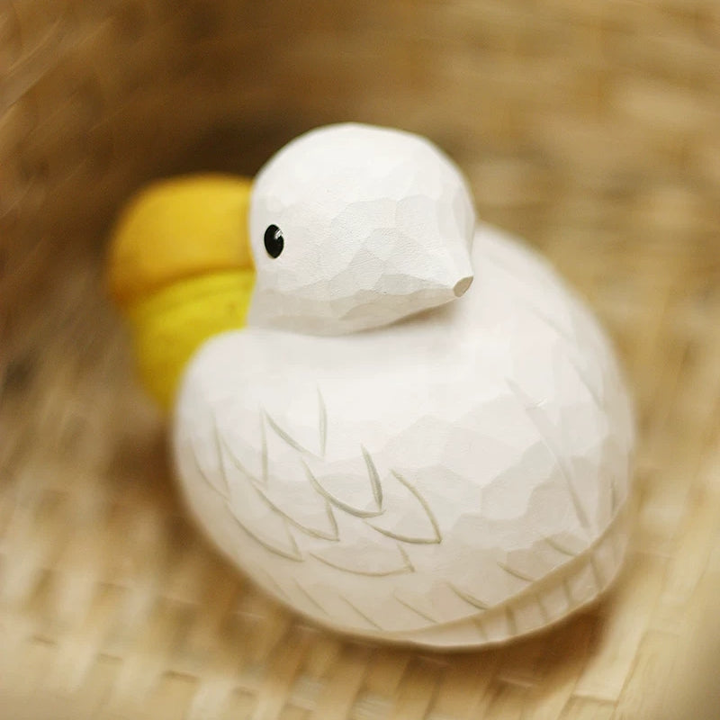 Pelican figurine showing its rounded carved body from behind