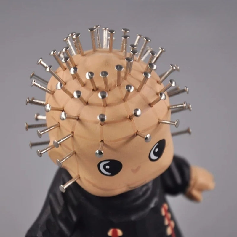 Top view of pinhead figurine head with metal pins
