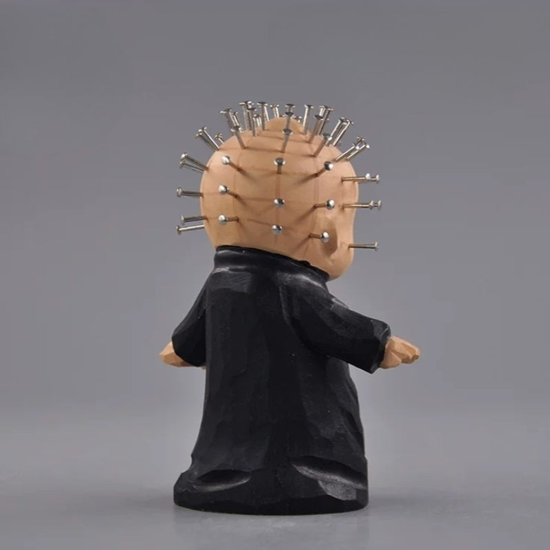 Back view of chibi pinhead wooden figurine