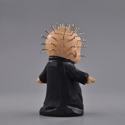 Back view of chibi pinhead wooden figurine