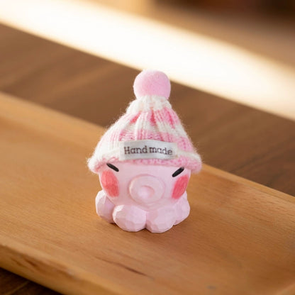Pink octopus figurine with knit hat
