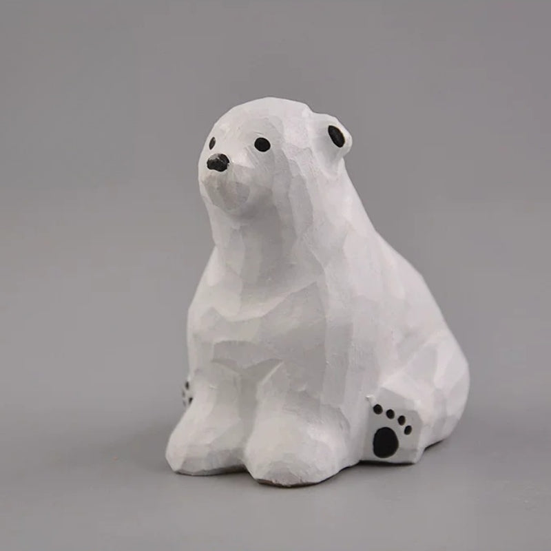 Sitting polar bear wood carving angled view