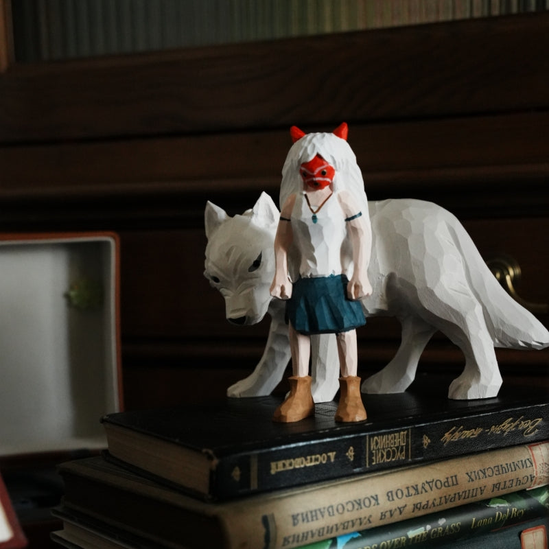 wooden Princess Mononoke figurine standing on stacked books