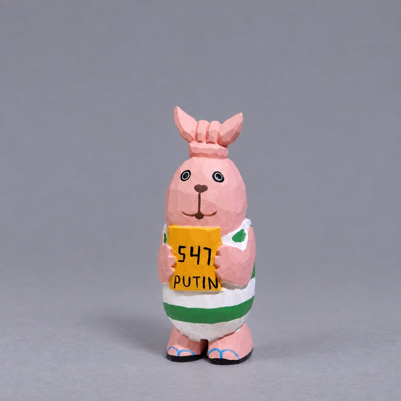 Putin wooden Usavich figure with tied ears and green-and-white stripes