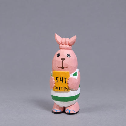 Putin wooden Usavich figure with tied ears and green-and-white stripes