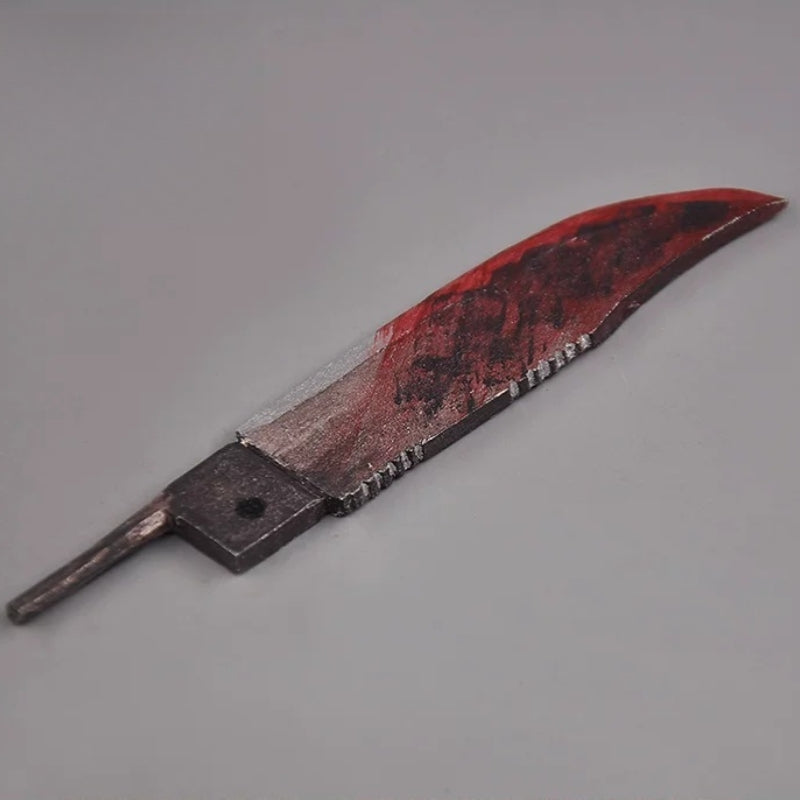 Removable wooden knife with mottled dark red and black paint