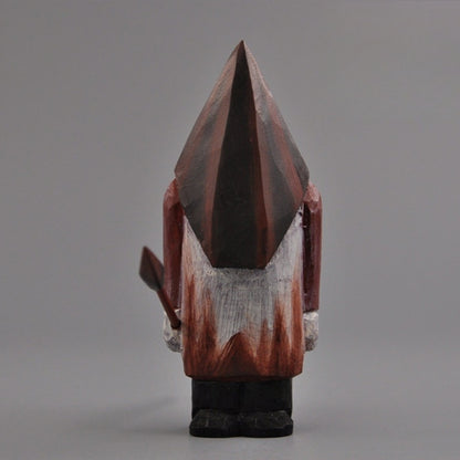 Full rear view of the wooden Pyramid Head statue against a neutral gray backdrop.