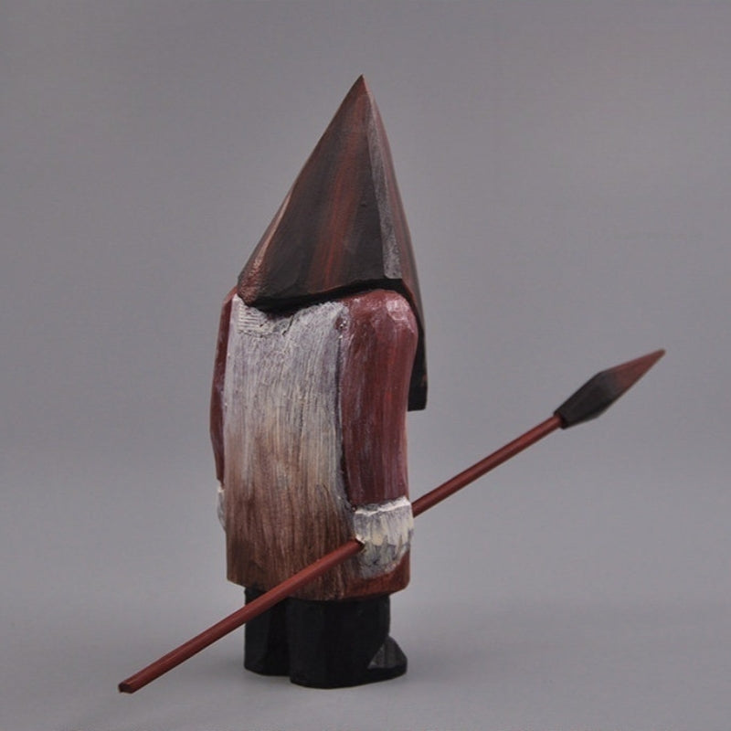 Angled back-side view of the Pyramid Head wooden figure with spear, showcasing the hand-painted coat details.