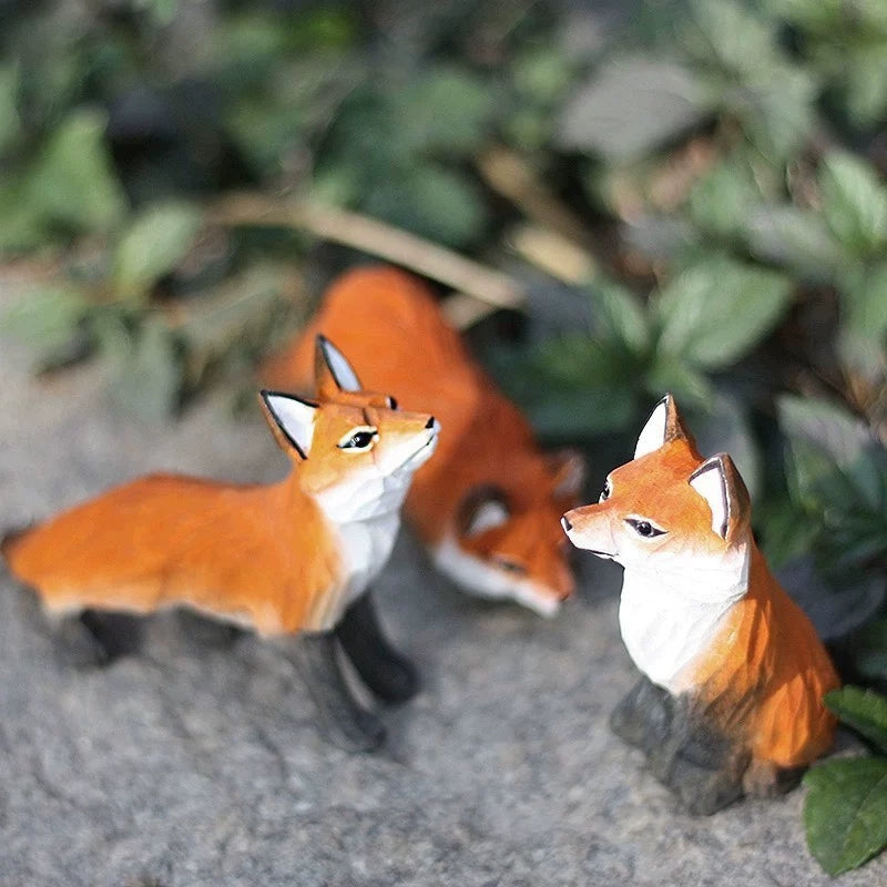 Red fox figurine set in three poses