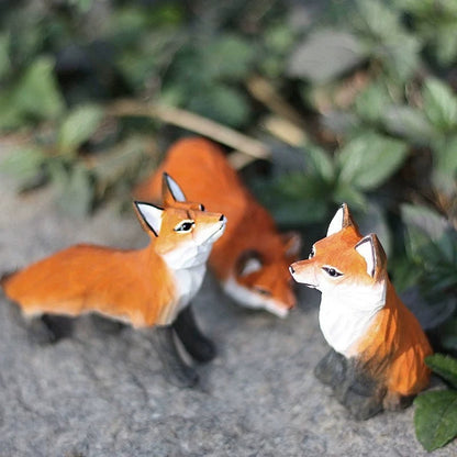 Red fox figurine set in three poses