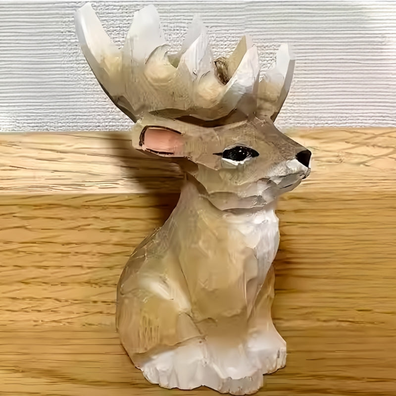 Reindeer figurines Christmas decor – hand-carved mini wooden statue with giant antlers on wooden surface.