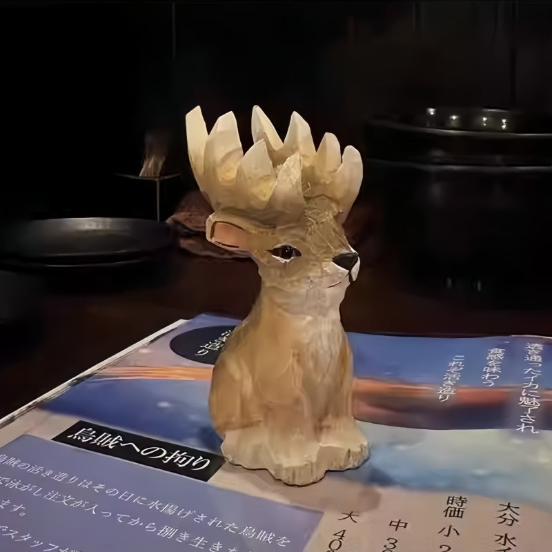 Wooden reindeer figurines for Christmas – rustic carving set on a Japanese restaurant menu.