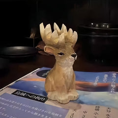 Wooden reindeer figurines for Christmas – rustic carving set on a Japanese restaurant menu.