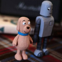 Close view of dog wooden figure beside the robot
