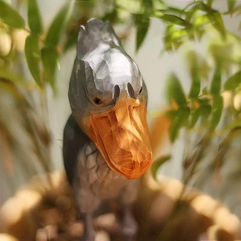 Front close view of a gray wooden Shoebill with its large yellow bill