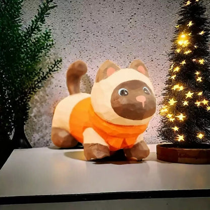 Siamese kitten figurine in orange sweater