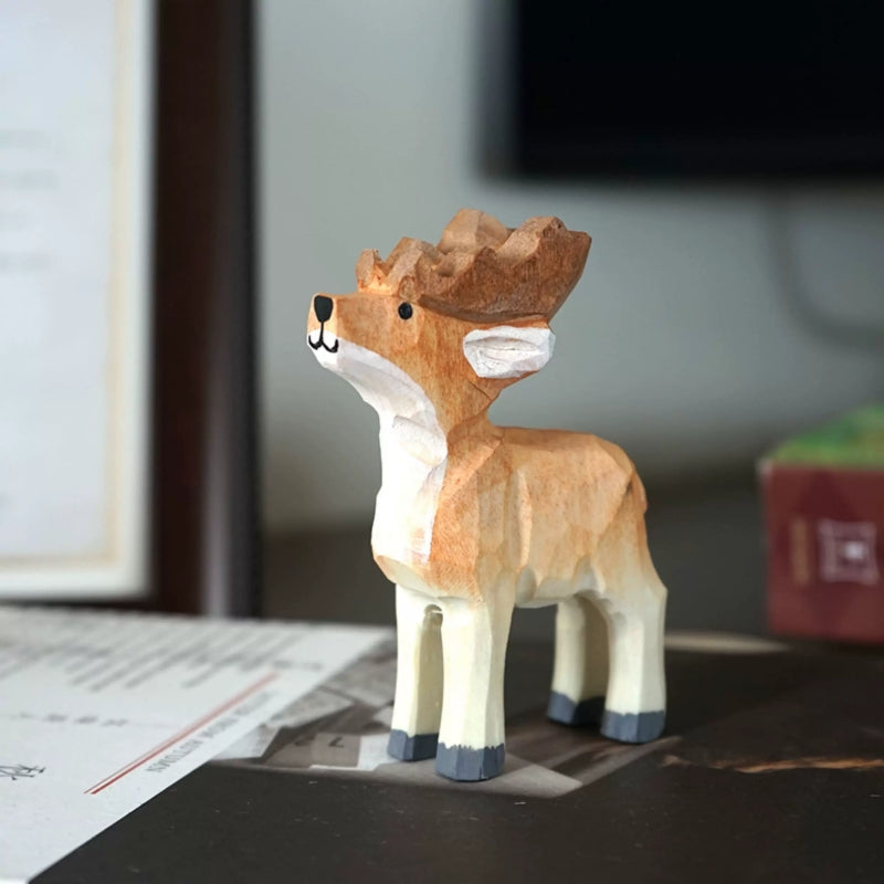 Single hand-carved Christmas reindeer figurine with a brown-and-white painted finish