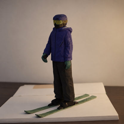 Three-quarter view of a wooden ski figurine standing on green skis