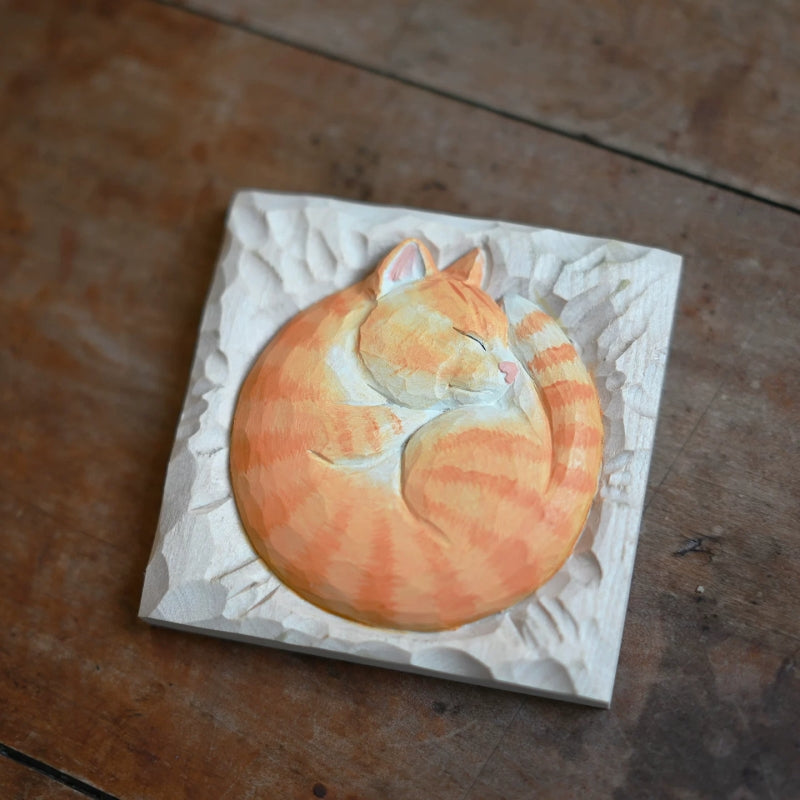 Sleeping cat wood carving top view curled pose